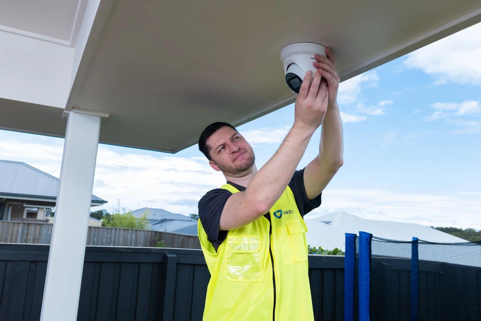 ANSIC technician installing a CCTV camera