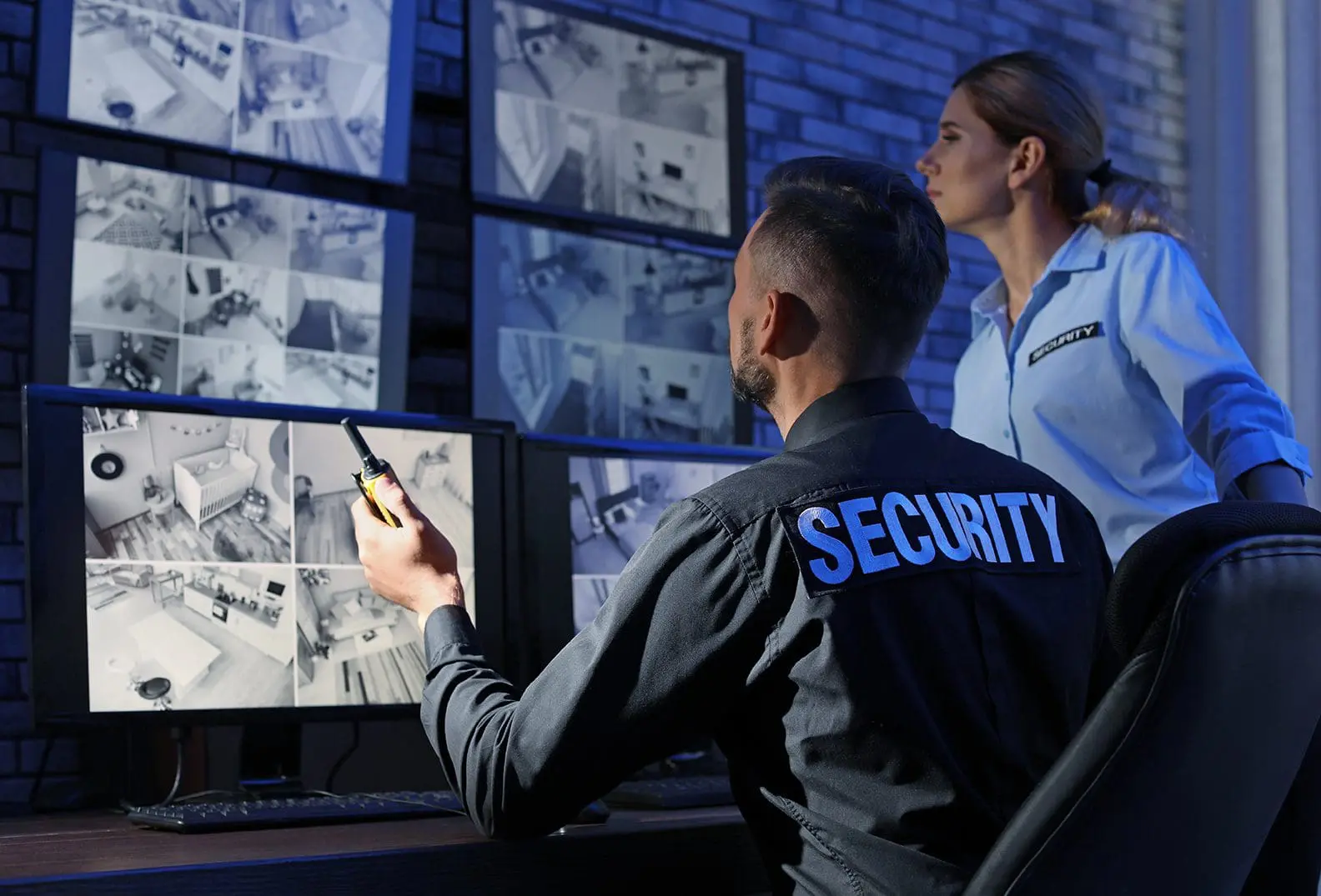 Security monitoring room with CCTV screens