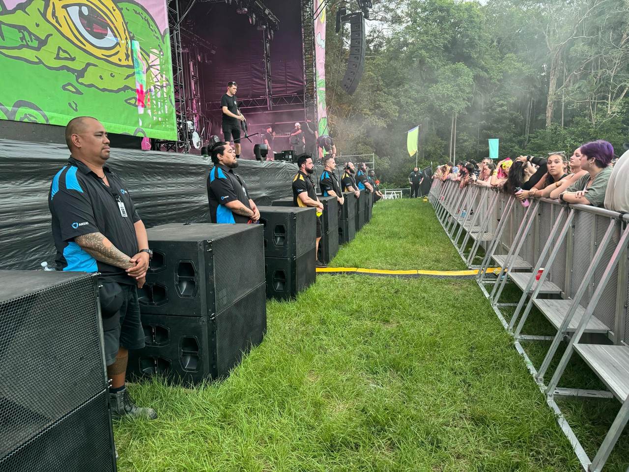 ANSIC officers in the pit at an outdoor festival stage