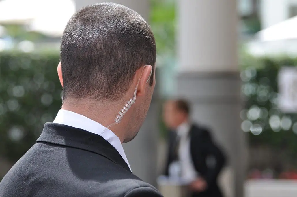 Close protection officer with an earpiece